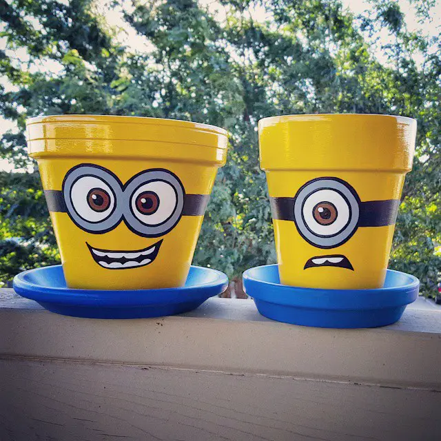 DIY Minion Terra Cotta Flower Pots - How to paint Minion characters from the movie on terra cotta flower pots. Great craft idea for kids