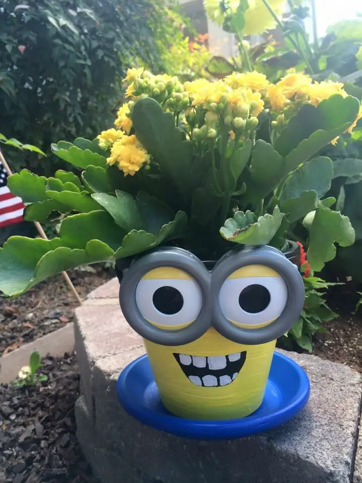 DIY Minion Terra Cotta Flower Pots - How to paint Minion characters from the movie on terra cotta flower pots. Great craft idea for kids