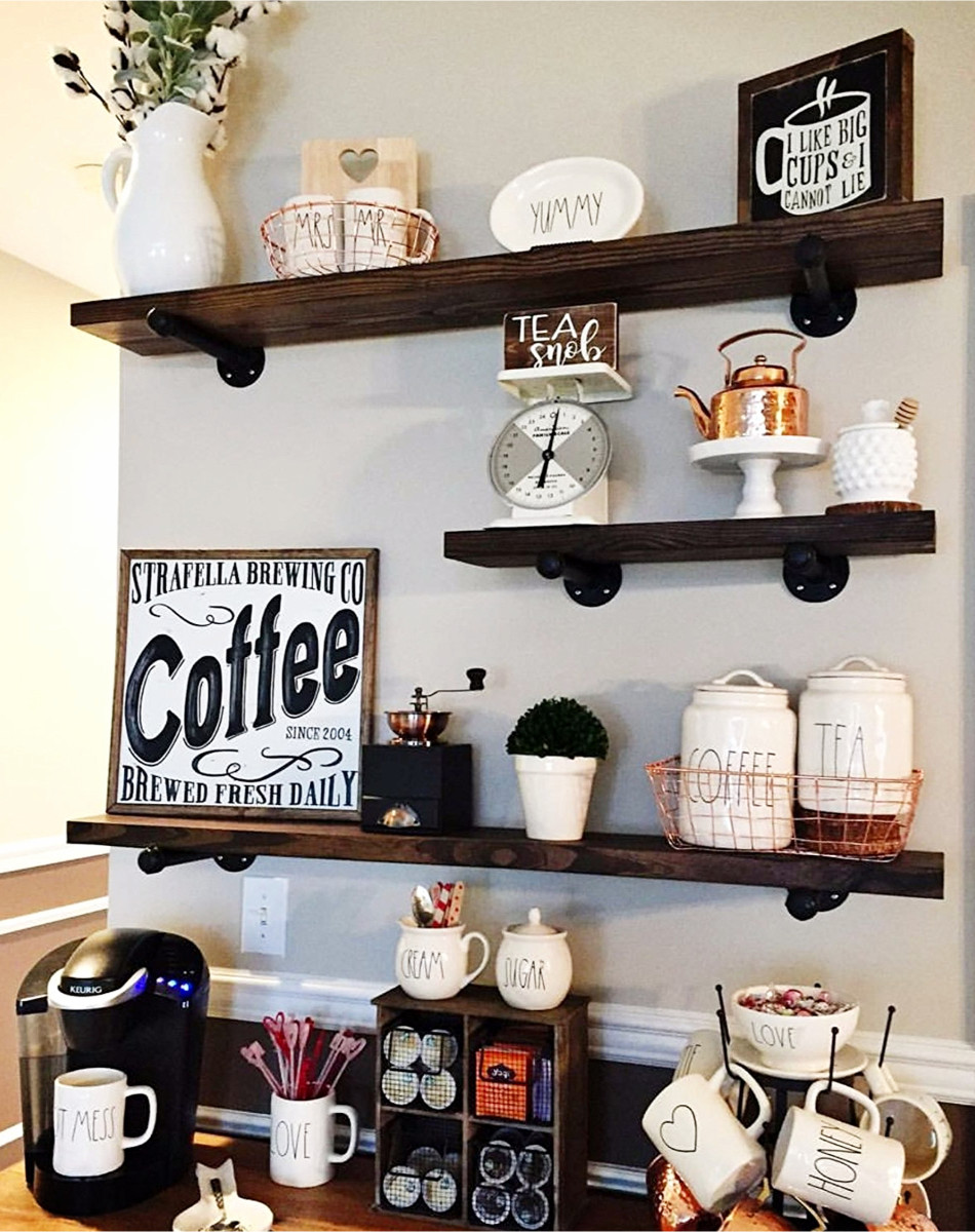 LOVE this home coffee bar area!  The Rae Dunn canisters, industrial pipe wall shelves, the mugs - all of it!