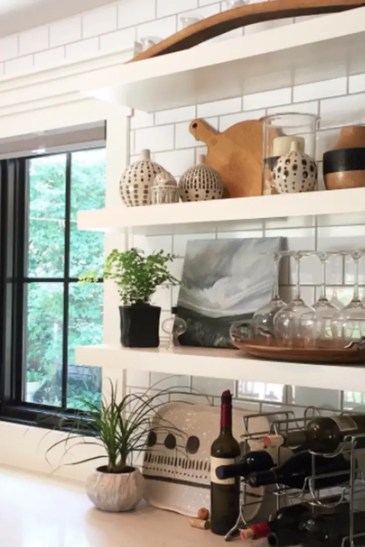 White Subway tiles behind open shelves really brighten up a kitchen and can make it look and feel bigger.