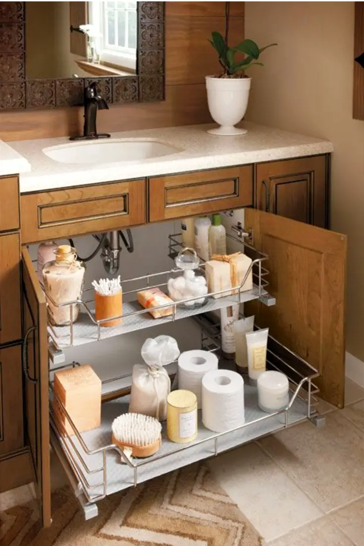 Brilliant way to organize under the sink in a small bathroom.  2 organized pull out shelves give a lot more space of organization and storage