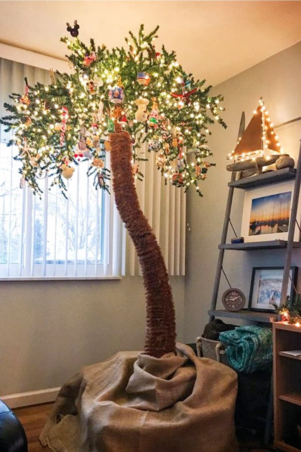 Christmas Tree ideas and unique Christmas tree alternatives - this palm tree Christmas tree is an affordable Christmas tree alternative for small spaces (small houses and apartments) -  I love a palm Christmas tree (or Christmas palm tree?) - fun and easy way to decorate your home for Christmas with a tropical flair - see more fake palm trees decorated for Christmas.