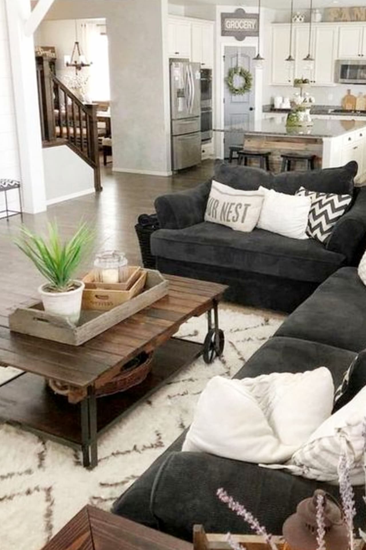neutral gray farmhouse living room / den in an open floorplan layout design