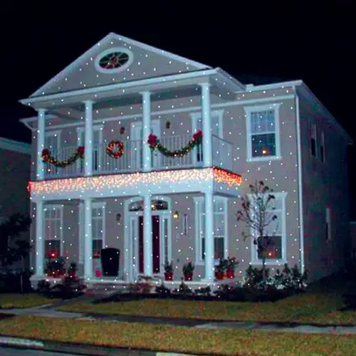 LOVE these Christmas lights projected on a house.  Looks like it