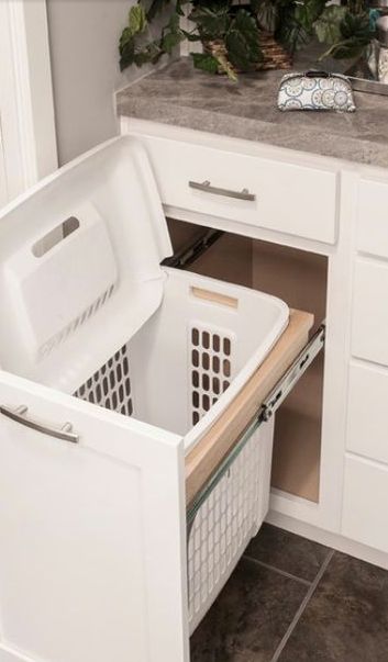 Bathroom storage ideas!  Easy DIY bathroom storage ideas for small spaces and bathroom organization hacks for organizing your bathroom on a budget. Bathroom storage hack - dirty clothes hamper under bathroom sink.