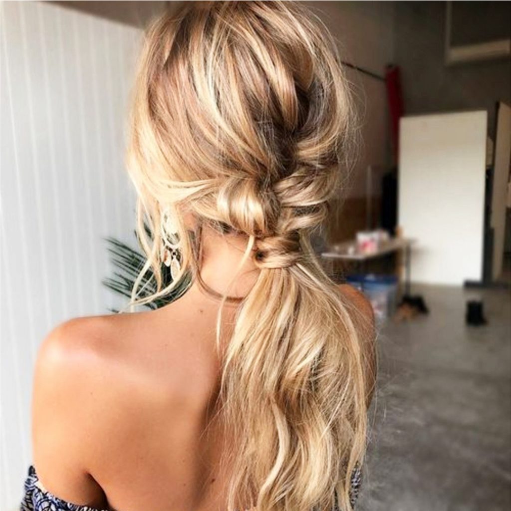 Easy ponytail hairstyles - love this twisted low ponytail idea