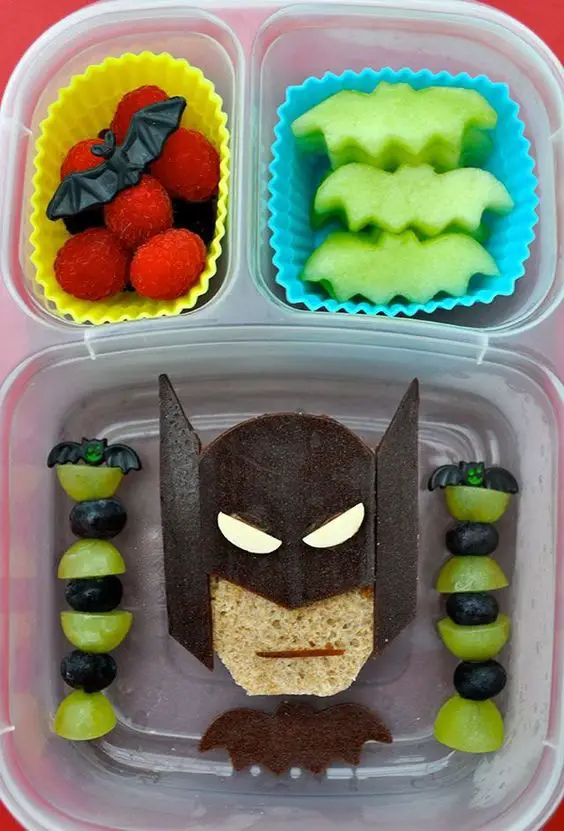 Healthy Snacks for Kids - quick healthy snacks for kids on the go, for kids to make and healthy snacks for kids lunch boxes at school - easy and fun healthy snacks for toddlers and preschoolers - fun school snacks for kids too! How about this Batman healthy fruit snack?!!?  That's a fun way to get your kids to eat healthy.