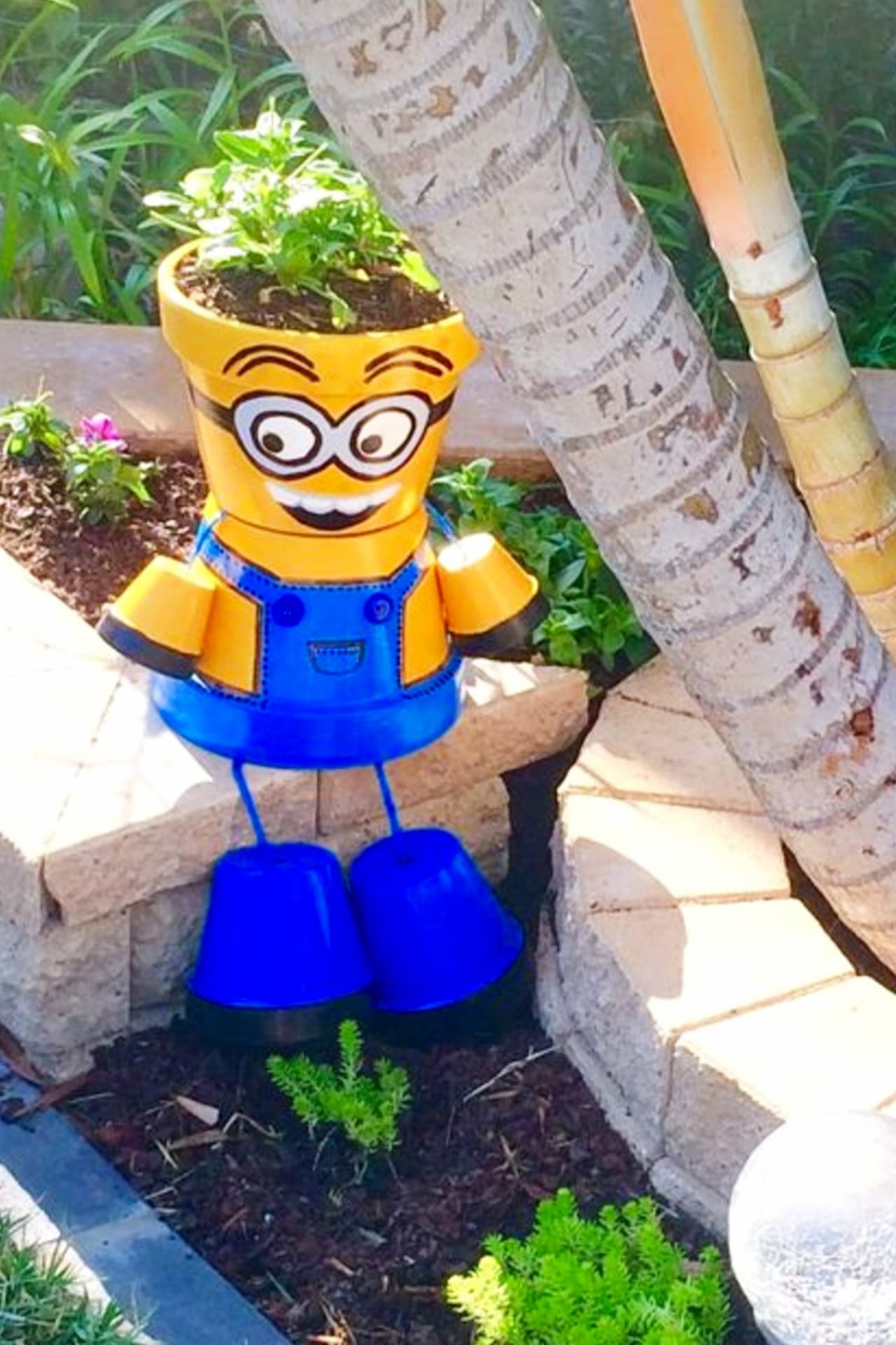 Minion Flower Pot People - Painted Flower Pot Ideas and DIY Flower Pot Crafts We Love