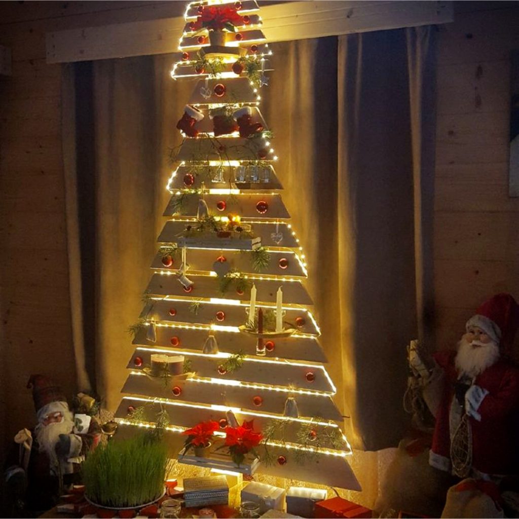 DIY Pallet Christmas Tree Ideas - We Tried It!  Make a Christmas tree from old pallets (tutorial video too)... painted ideas, with lights, decorated, indoors and outdoors ideas for front porches at Xmas.