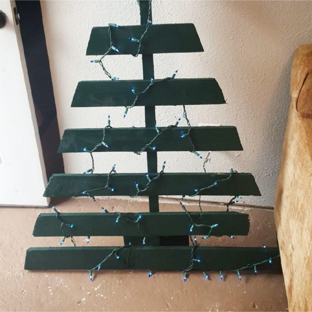 DIY Pallet Christmas Tree Ideas - We Tried It!  Make a Christmas tree from old pallets (tutorial video too)... painted ideas, with lights, decorated, indoors and outdoors ideas for front porches at Xmas.