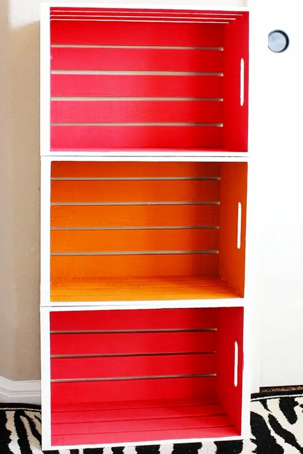 DIY crate bookshelf - love the painted colors inside the stacked wooden crates