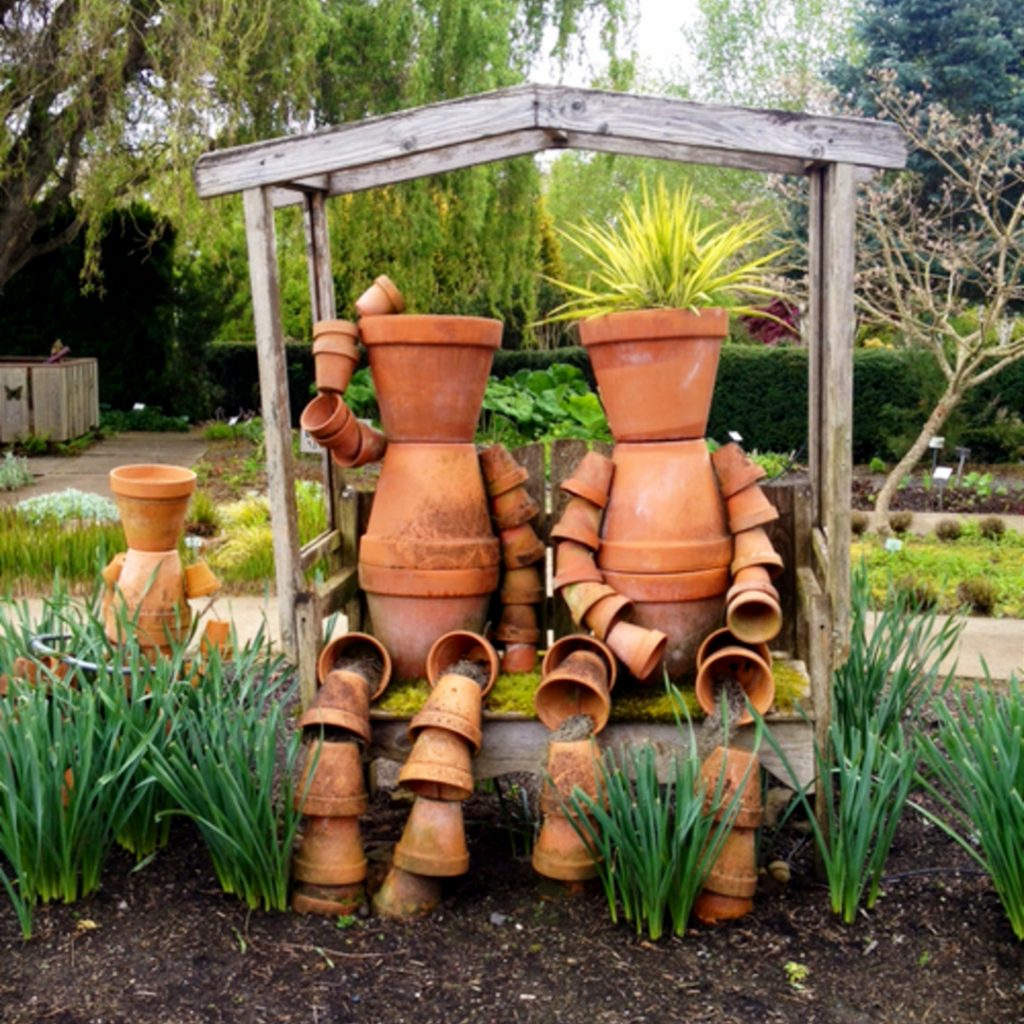 LOVE these clay pot people made out of flower pots!