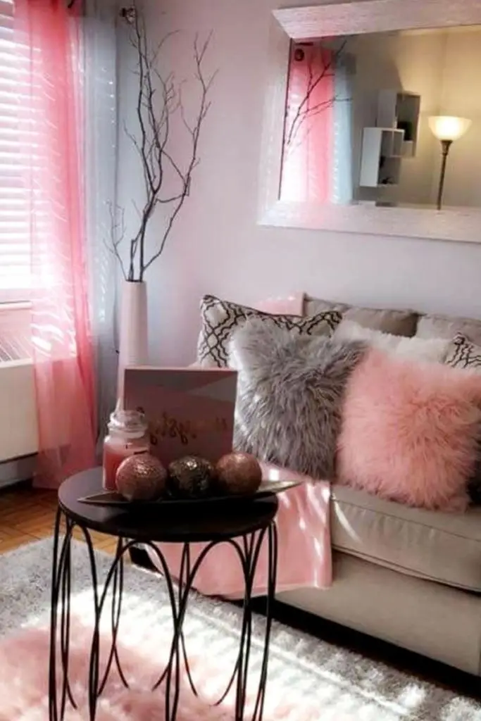 Add a feminine decor touch to a small grey living room to make it aesthetic, warm and cozy