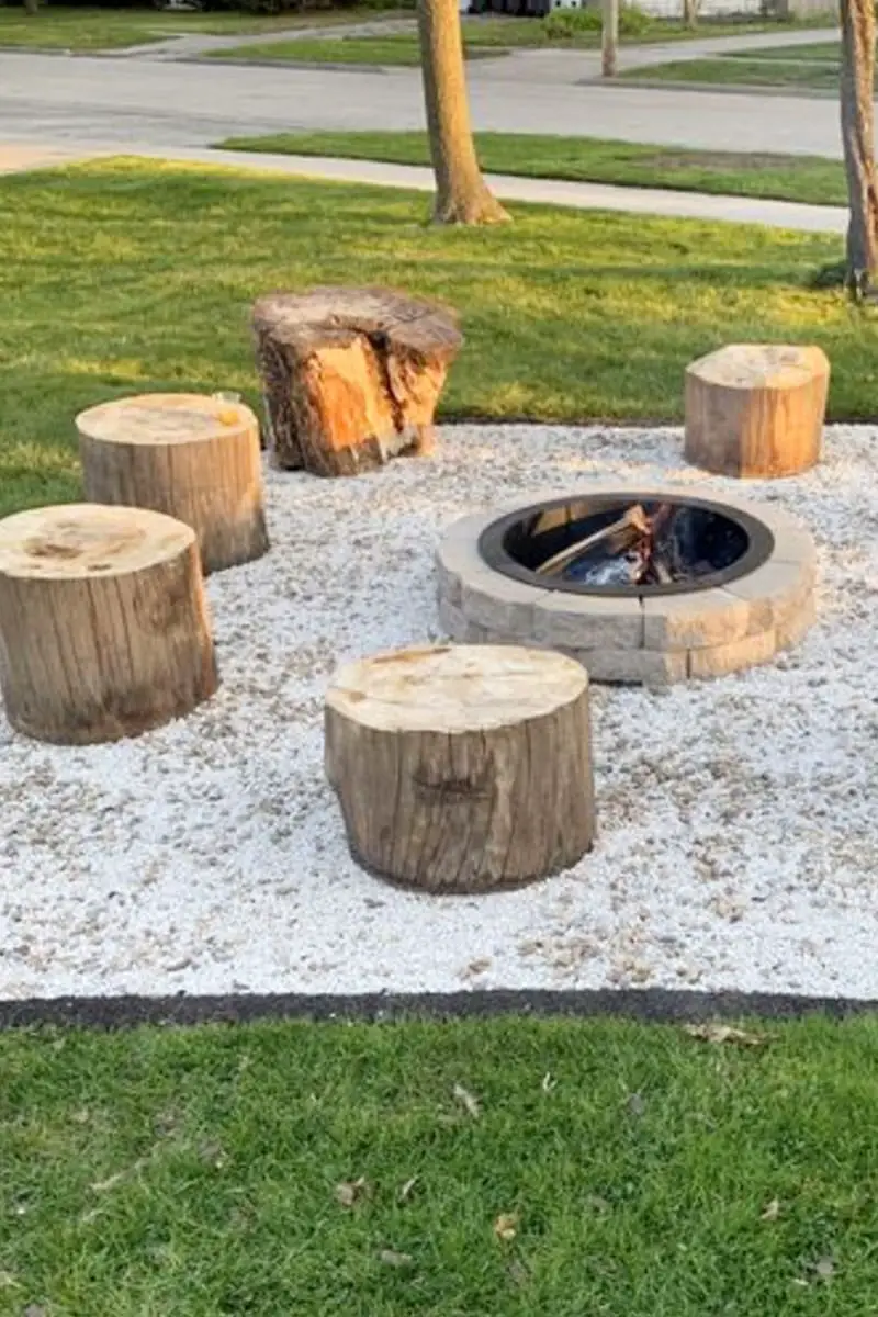 Front yeard fire pit with stump seating - perfect for a rustic primitive and simple firepit