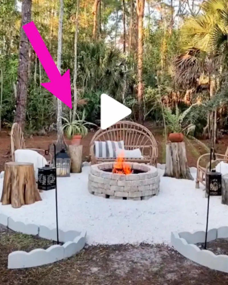 fire pit seating area design idea - stumps and old logs, wicker loveseat bench and comfy chairs around white gravel DIY backyard block fire pit