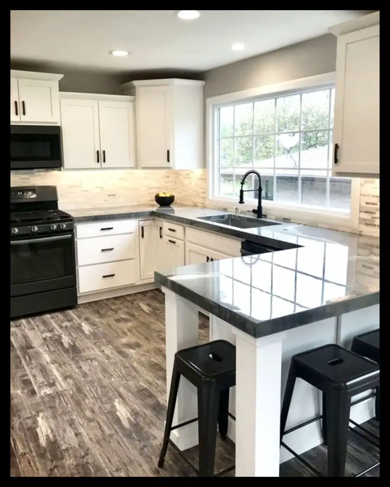 Grey and white kitchen ideas with black accent color trim countertops and stools - love the white painted cabinets in this small modern kitchen