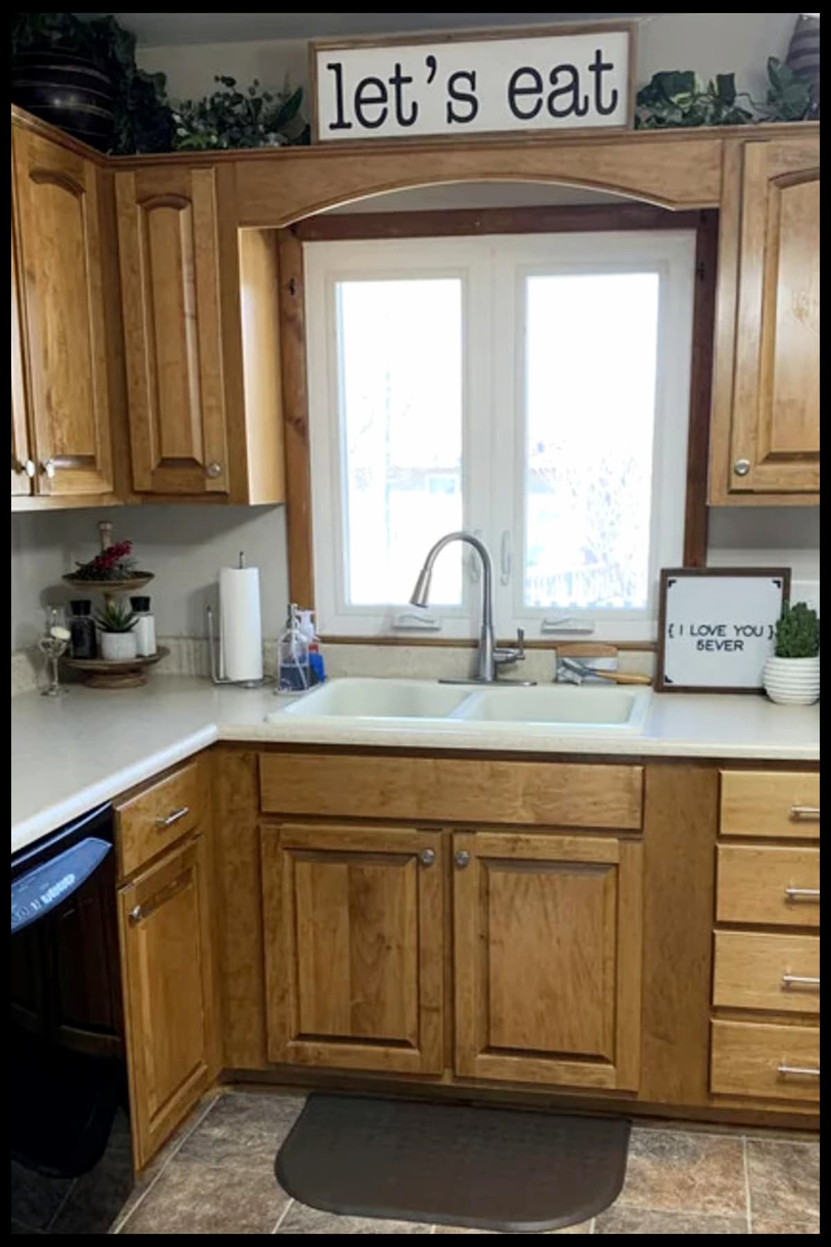 decorating with fake plants in kitchen top of cabinets and on counter