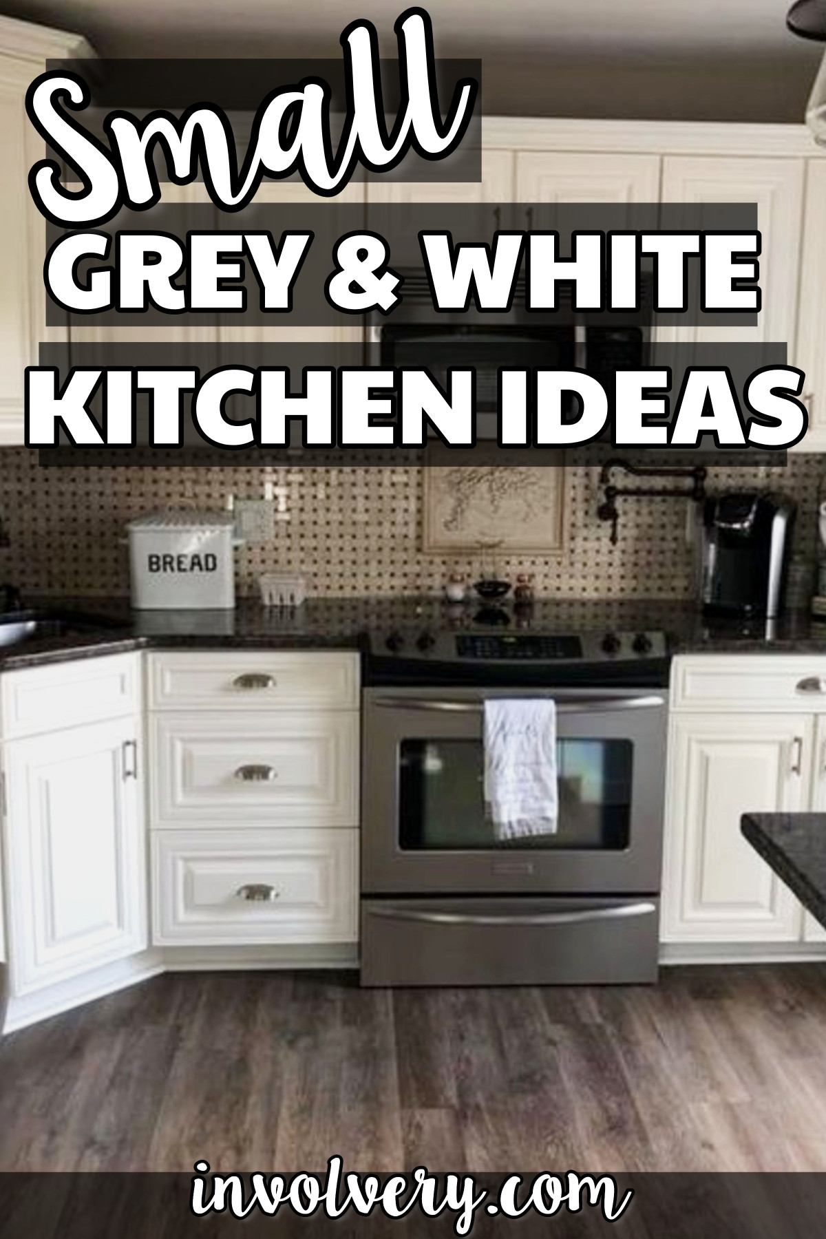 kitchen makeover with dark countertops and white cabinets