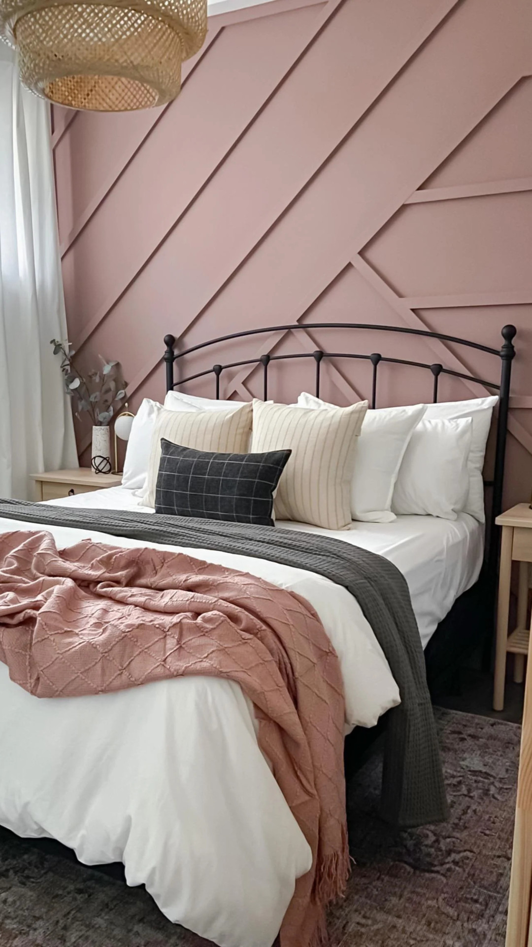 cozy neutral bedroom with dusty rose pink accent wall
