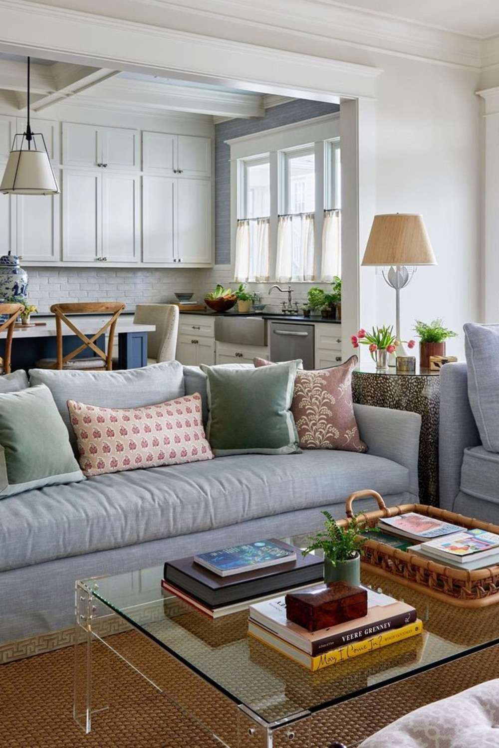 cozy grey couch living room open living room kitchen layout muted warm pastel accent colors